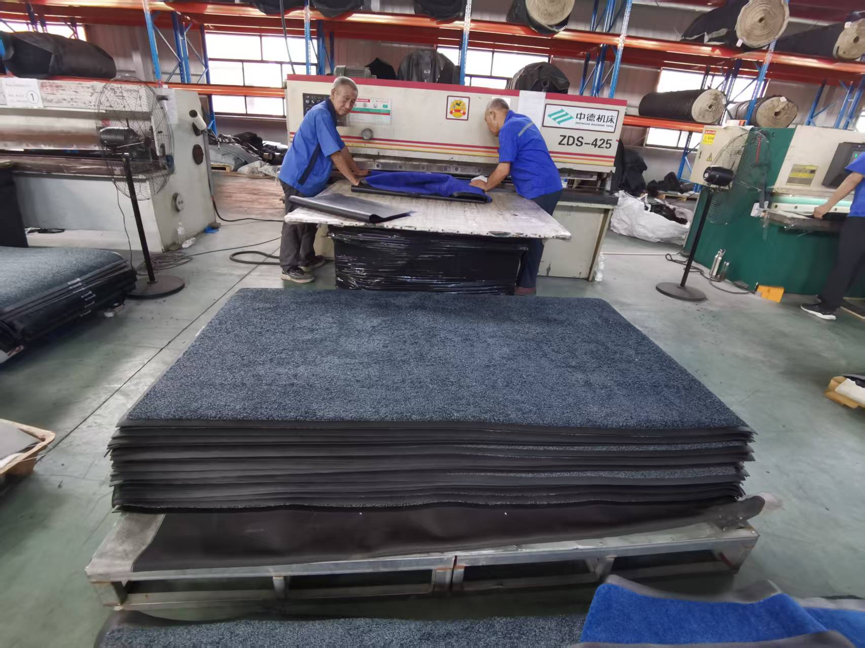 Entrance mats being cut and stacked in the factory